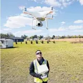  ?? GERRY BROOME/AP ?? Michael Jones with his drone in Goldsboro, N.C. After a couple of years of shooting drone photos and videos for clients, the state ordered him to ground the craft.