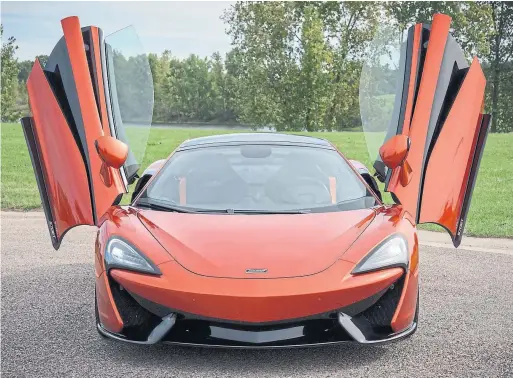  ?? BEN SANDERS AUTOGUIDE.COM ?? With bright orange paint, crazy-looking dihedral doors and exotic styling, the McLaren 570GT is not for the faint of heart - or the shy.