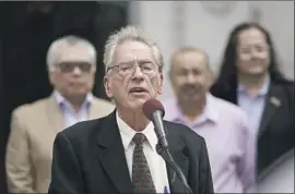  ?? Kent Nishimura Los Angeles Times ?? PETER SCHEY, city advocate for immigrant affairs, speaks at L.A. City Hall. He said there is a plan to sue over the end of some immigrants’ protected status.