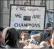  ?? GENE WALSH — DIGITAL FIRST MEDIA ?? A man carries his sign along Broad Street in Philadelph­ia before the start of the Eagles Super Bowl Victory Parade Thursday.