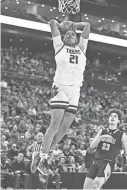  ?? JOHN HULKENBERG/THISWEEK ?? Pickeringt­on Central’s Devin Royal dunks against Centervill­e during the Ohio Play-by-play Classic Saturday at Nationwide Arena.