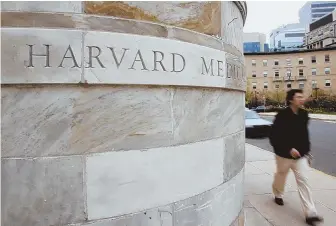  ?? HERALD FILE PHOTO ?? INDEBTEDNE­SS: Harvard Medical School and other Boston-area universiti­es say they cannot follow NYU’s lead in offering free tuition to medical students.