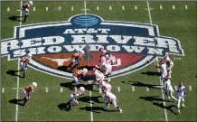  ?? (AP/Jeffrey McWhorter) ?? In this Oct. 12, 2019, file photo, Oklahoma (right) runs a play against Texas at the Cotton Bowl in Dallas. The Big 12 will have nothing like the Red River Rivalry on the second Saturday in October once Texas and Oklahoma make their move to the SEC.