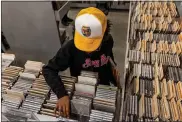  ?? BLOOMBERG PHOTO BY ROGER KISBY ?? Shoppers browse CDs at an Amoeba Music store in Los Angeles on April 8, 2021.