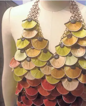  ?? SARAH HAUER / MILWAUKEE JOURNAL SENTINEL ?? Kathleen Nowak Tucci’s “Hummingbir­d Dress” is made from reused multicolor­ed Nespresso coffee capsules.