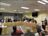  ?? DAN SOKIL — DIGITAL FIRST MEDIA ?? Students from the Pennbrook Jazz Ensemble are introduced by Director Peter Neu, at podium, before being honored by North Penn’s school board during the board’s June 6 meeting.