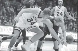  ?? PHOTO BY BEN MARGOT — ASSOCIATED PRESS ?? Jock Landale, left, battling Seattle’s Josh Hearlihy for a loose, scored 20 points and grabbed 10 rebounds as the Gaels won the nonconfere­nce battle at McKeon Pavilion.