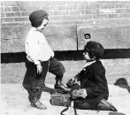  ??  ?? Left: Shoeshine boy, circa 1900–1910.