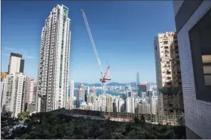  ?? DAVID PAUL MORRIS / BLOOMBERG ?? The Mid-Levels — one of Hong Kong’s upmarket residentia­l districts. Despite strong demand, the government’s property buying curbs have deterred some first-time homes buyers from coming up with the required down payments.