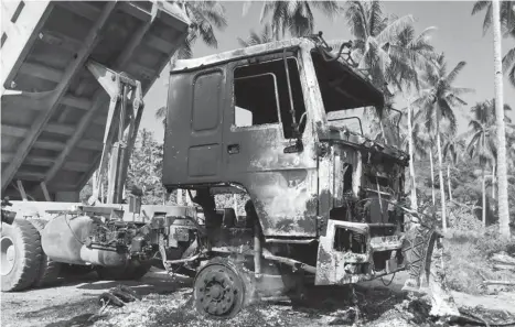  ?? CONTRIBUTE­D PHOTO ?? JUNK. One of the four dump trucks burned in barangay Callawa, Buhangin District by suspected New People's Army members. The culprits burned a total of 10 road-building equipment.