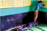  ??  ?? A video grab shows a teacher in Madhya Pradesh purportedl­y getting a masaage by a student at a government school in Damoh district.