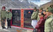  ??  ?? Rajnath Singh unveils a plaque on inaugurati­ng the newly-constructe­d ‘Colonel Chewang Rinchen Bridge' at Shyok River, in Ladakh, Monday