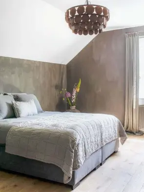  ??  ?? MAIN BEDROOM
Leaving brushstrok­e marks on the wall enhances the decor. Nice Plaid bed throw in Cloudy Gray, €199.95, House of Style. For a similar wall paint, try Limewash in Elephant, £22 for 10ltr, Mike Wye