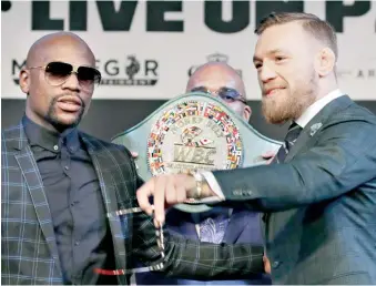  ?? AP ?? Mayweather y Mcgregor son la representa­ción del dominio de sus disciplina­s.