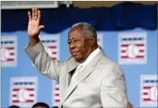  ?? AP PHOTO BY MIKE GROLL ?? Hall of Famer Hank Aaron waves to the crowd during Baseball Hall of Fame induction ceremonies in Cooperstow­n, N.Y., in this Sunday, July 28, 2013, file photo.