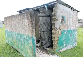  ??  ?? POOR FACILITIES Teachers at Amambalu Junior Secondary School near Mqanduli have to share eight dilapidate­d and crumbling pit toilets with nearly 150 pupils. All of them lack doors and toilet seats