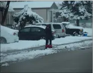  ?? ?? Sterling residents begin shoveling sidewalks Thursday afternoon.