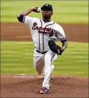  ?? MIKE ZARRILLI / GETTY IMAGES ?? The Braves Julio Teheran has steadily improved after some early-season stumbles as part of a steadilyim­proving pitching core.