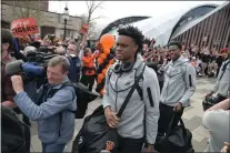  ?? JOHN BERRY — TRENTONIAN PHOTO ?? Princeton Men’s Basketball team heads to the bus with fanfare and cheers from the crowd outside of Jadwin Gym Wednesday.
