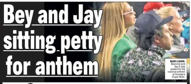  ??  ?? BAD LOOK: Beyoncé and Jay-Z stay seated for the national anthem at Sunday’s Super Bowl.