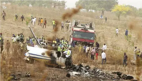  ?? PHOTO: PHILIP OJISUA ?? Wreckage of crashed military plane at Bassa village, near Nnamdi Azikiwe Internatio­nal Airport, Abuja as rescue workers clear debris… yesterday.