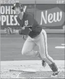  ?? MARK J. TERRILL/ THE ASSOCIATED PRESS ?? Brewers right fielder Ryan Braun watches a two-run home run off Dodgers pitcher Clayton Kershaw leave the park in the fourth inning of Saturday’s 3-2 victory.