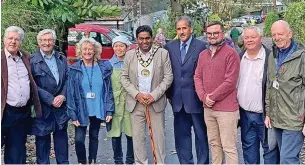  ?? ?? ●●Mayor of Rochdale, Cllr Ali Ahmed at the reopening of the Dell Road along with fellow councillor­s, Cllr Daniel meredith, Cllr Tricia Ayrton, Cllr Shah Wazir, Cllr Shaun O’neill, leader of the council - Cllr neil Emmott and Tony Lloyd MP.