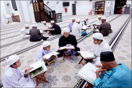  ?? ?? Mohamad Haeqal recommends that besides making it a practice to multiply reciting the Quran in the blessed Ramadan, the Muslim community can perform their acts of worship together.
