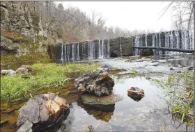  ?? NWA Democrat-Gazette/FLIP PUTTHOFF ?? A dam creates a small lake and another waterfall at the park.