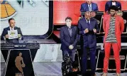  ?? [AP PHOTO] ?? Lakers president Magic Johnson, center, celebrates after getting the No. 2 overall pick for the 2017 draft. Johnson is flanked by Celtics co-owner Wyc Grousbeck and 76ers center Joel Embiid.