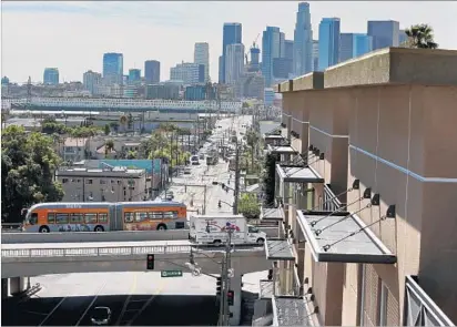  ?? Los Angeles Times ?? THE CONSTRUCTI­ON of affordable housing, as shown at right, is essential as Los Angeles developmen­t moves forward.