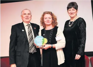  ??  ?? Cllr John Anderson with SLC partnershi­p manager Kay McIntosh and awards host Sarah Jackson OBE