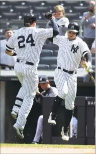  ?? Al Bello / Getty Images ?? The Yankees’ Gary Sanchez (24) celebrates with Clint Frazier after Sanchez’ first-inning home run against the Orioles at Yankee Stadium on Wednesday.