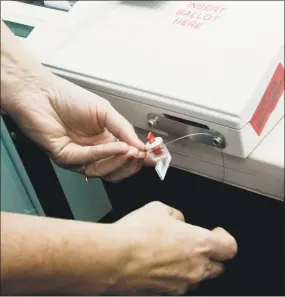  ?? Scott Mullin / For Hearst Connecticu­t ?? Election machines are sealed after testing, at DataGuard in Stamford on Thursday.