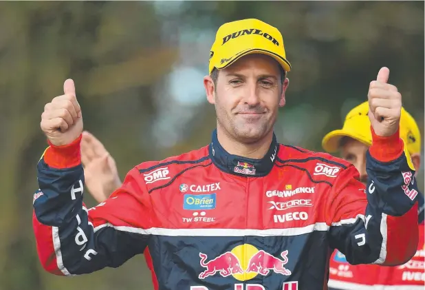  ?? Picture: GETTY IMAGES ?? CATCH ME IF YOU CAN: Jamie Whincup, driver of the #88 Red Bull Holden Racing Team Holden Commodore VF, celebrates on the podium after the Gold Coast 600, which is part of the Supercars Championsh­ip, at Surfers Paradise Street Circuit yesterday.