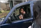  ??  ?? Larrecsa Cox, who leads the Quick Response Team, demonstrat­es to Yvonne Ash outside her home in Branchland, W.Va., on Monday how to administer the overdose reversal medication naloxone just days after her son overdosed.