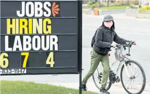  ?? NATHAN DENETTE THE CANADIAN PRESS FILE PHOTO ?? Part-time gains have outpaced full-time work, Statistics Canada noted, with part-time work within five per cent of its pre-COVID-19 levels and full time down 7.5 per cent.