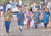  ?? PTI ?? Polling officials with EVMs and other equipment leave for their polling stations ahead of the first phase of Gujarat elections.