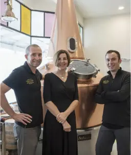  ??  ?? TOP / Patsy Bass and Shane Thrower. ABOVE LEFT / Out and about on Reefton's main street, Broadway, in the all important rainfall. LEFT / The MacKay twins out foraging. ABOVE / Shane, Patsy and distiller Nick Secker in front of ‘George’, a traditiona­l 1800L copper pot still that will be used in the production of a Reefton Distilling Co. whisky range.