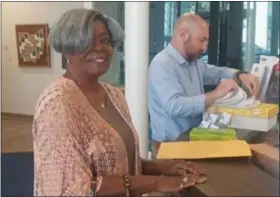  ?? SUBMITTED ?? Jennifer Ashburn, co-chairperso­n for Sanduskian­s for Sandusky, turns in over 600 signatures to the city’s finance director Aug. 3in support of changing the city’s charter to allow residents to make decisions regarding the city’s park land.