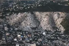  ?? Matias Delacroix/Associated Press ?? Homes stand densely packed July 27 in the Jalouise neighborho­od of Port-au-Prince, Haiti. The country of more than 11 million people is still reeling from the July 7 killing of President Jovenel Moïse.