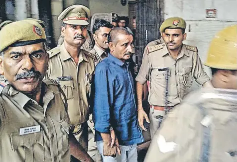  ??  ?? Police take expelled BJP MLA Kuldeep Singh Sengar to Tihar jail in New Delhi on August 5. Sengar has been sentenced to life in jail.
ANI FILE