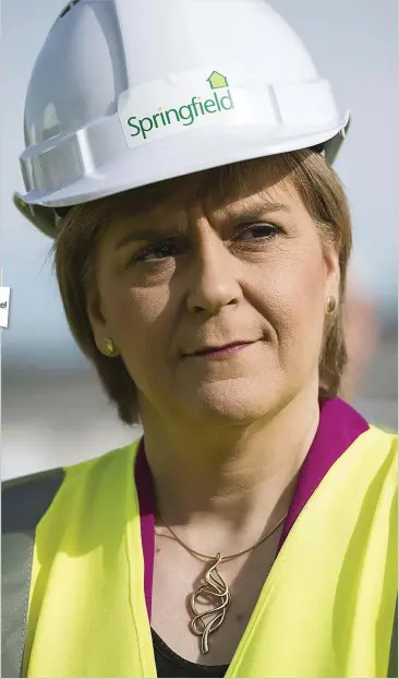  ??  ?? COMPANY WOMAN: Nicola Sturgeon wearing Springfiel­d branded clothing at Braehead in April 2015