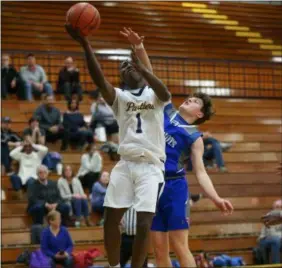  ??  ?? TIM PHILLIS — FOR THE NEWS-HERALD Euclid’s Garvin Clarke goes up for a layup against Open Door Christian on Feb. 19.