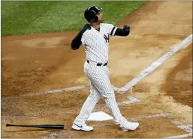  ?? KATHY WILLENS — THE ASSOCIATED PRESS ?? The Yankees’ Aaron Hicks watches his three-run home run against the Astros during the first inning in Game 5on Friday in New York.