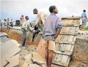  ?? Picture: ADRIEN BARBIER/AFP ?? IN RUINS: A damaged section of the road between Beira and Chimoio in Mozambique