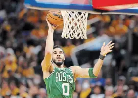  ?? EZRA SHAW GETTY IMAGES ?? Boston won Game 1 of the NBA finals Thursday night, 120-108, despite three-for-17 shooting from Jayson Tatum, who more than made up for that by finishing with 13 assists.