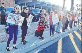  ?? Aleksandra Appleton Las Vegas Review-journal ?? Substitute­s protest Thursday ahead of a Clark County School District board meeting.