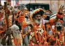  ?? PTI ?? Sadhus participat­e in a procession in Haridwar on Monday