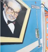  ?? STEVEN SENNE/AP 2017 ?? A mural featuring Theodor Seuss Geisel covers part of a wall near an entrance at The Amazing World of Dr. Seuss Museum in Springfiel­d, Massachuse­tts.